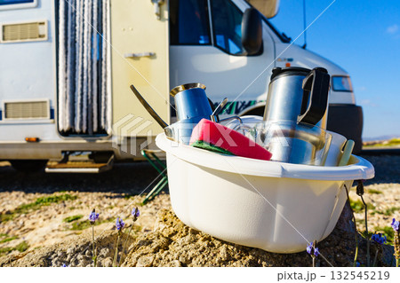 Washing dishes in bowl, capming outdoor Washing dishes in bowl, capming outdoor 132545219