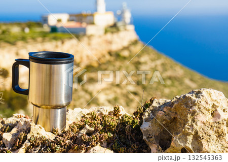 Thermal mug, thermos on nature. Travel outdoor picnic. Thermal mug, thermos on nature. Travel outdoor picnic. 132545363