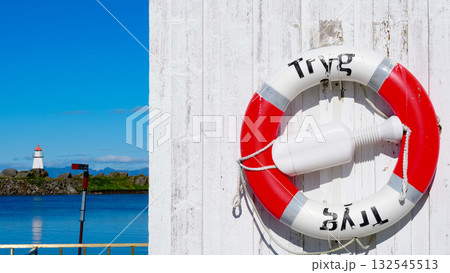 Rescue ring and lighthouse, Hovsund Lofoten Norway Rescue ring and lighthouse, Hovsund Lofoten Norway 132545513
