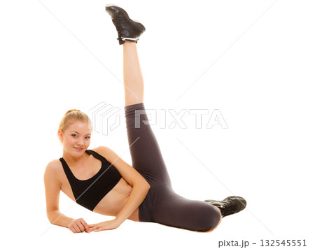 woman in sportswear doing stretching exercise woman in sportswear doing stretching exercise 132545551