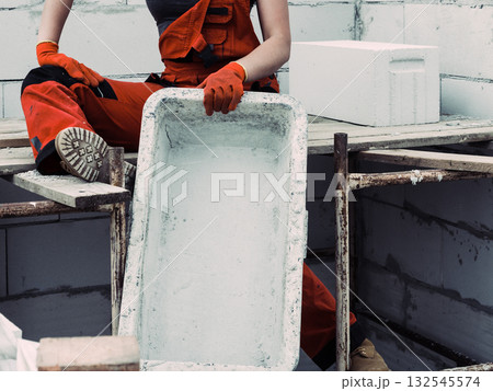 Female builder working build new house 132545574