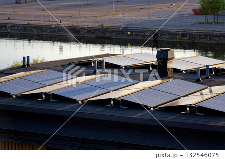 Solar panels on roof of apartment building, renewable green sustainable energy concept, water cooling, aerial view 132546075
