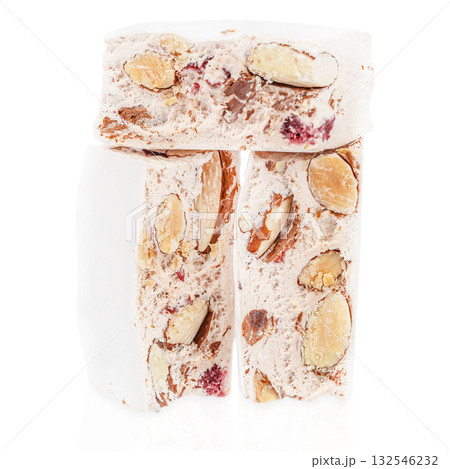 Traditional Italian nougat torrone with almonds and dried berries isolated on white background, sweet festive dessert concept 132546232
