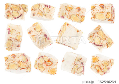 Set of traditional Italian nougat torrone pieces with almonds and dried fruits isolated on white background, festive dessert concept 132546234