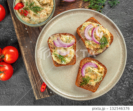 Traditional crispy pork cracklings served as a savory snack on a rustic background Traditional crispy pork cracklings served as a savory snack on a rustic background 132546376