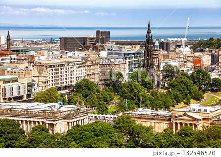Edinburgh cityscape with Scott Monument and Princes Street Gardens Scotland UK 132546520