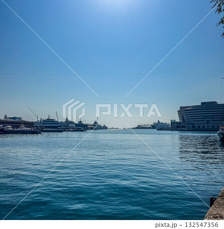 Harbor with Yachts and Cruise Terminal under Blue Sky 132547356