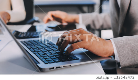 Accounting company provide finance and taxation planning for profitable cash flow, Auditor and accountant team working in office, analyze financial data and accounting record with calculator.Insight Accounting company provide finance and taxation planning for profitable cash flow, Auditor and accountant team working in office, analyze financial data and accounting record with calculator.Insight 132548472