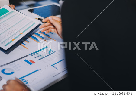 Accounting company provide finance and taxation planning for profitable cash flow, Auditor and accountant team working in office, analyze financial data and accounting record with calculator.Insight 132548473