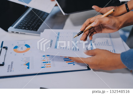 Accounting company provide finance and taxation planning for profitable cash flow, Auditor and accountant team working in office, analyze financial data and accounting record with calculator.Insight 132548516