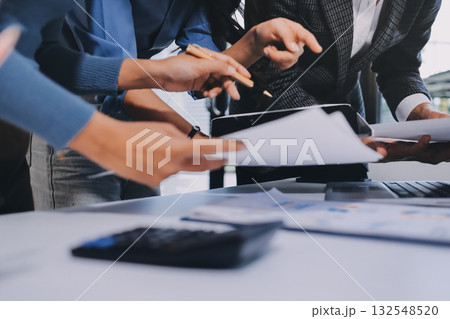 Accounting company provide finance and taxation planning for profitable cash flow, Auditor and accountant team working in office, analyze financial data and accounting record with calculator.Insight Accounting company provide finance and taxation planning for profitable cash flow, Auditor and accountant team working in office, analyze financial data and accounting record with calculator.Insight 132548520