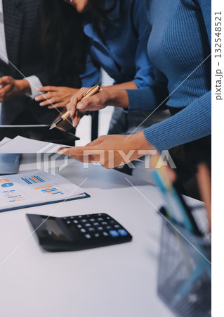 Accounting company provide finance and taxation planning for profitable cash flow, Auditor and accountant team working in office, analyze financial data and accounting record with calculator.Insight Accounting company provide finance and taxation planning for profitable cash flow, Auditor and accountant team working in office, analyze financial data and accounting record with calculator.Insight 132548521