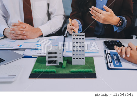 Real estate agent and customer signing contract to buy house, insurance or loan real estate.rent a house,get insurance or loan real estate or property. Real estate agent and customer signing contract to buy house, insurance or loan real estate.rent a house,get insurance or loan real estate or property. 132548545