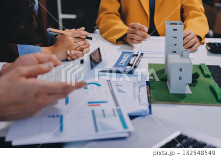 Real estate agent and customer signing contract to buy house, insurance or loan real estate.rent a house,get insurance or loan real estate or property. Real estate agent and customer signing contract to buy house, insurance or loan real estate.rent a house,get insurance or loan real estate or property. 132548549