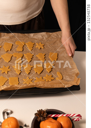Preparing Gingerbread Cookies for Christmas Celebration Preparing Gingerbread Cookies for Christmas Celebration 132548738