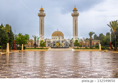Square in front of mausoleum of Habib Bourguiba with two minarets on a cloudy day with decorated marble courtyard, Monastir, Tunisia Square in front of mausoleum of Habib Bourguiba with two minarets on a cloudy day with decorated marble courtyard, Monastir, Tunisia 132549650