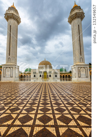 Square in front of mausoleum of Habib Bourguiba with two minarets on a cloudy day with decorated marble courtyard, Monastir, Tunisia Square in front of mausoleum of Habib Bourguiba with two minarets on a cloudy day with decorated marble courtyard, Monastir, Tunisia 132549657