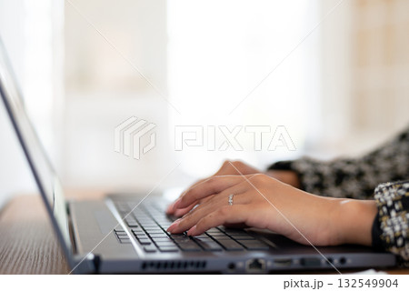 Female hands typing on laptop keyboard close-up 132549904