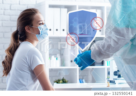 Medical professional conducts COVID-19 test with patient in a clinic setting Medical professional conducts COVID-19 test with patient in a clinic setting 132550141
