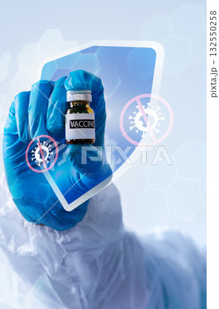 Healthcare worker holds vaccine vial to demonstrate protection against diseases 132550258