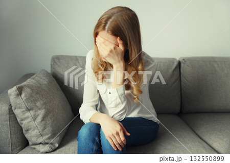 Upset sad crying woman while experiencing mental suffering, depression, fatigue, emotional stress 132550899