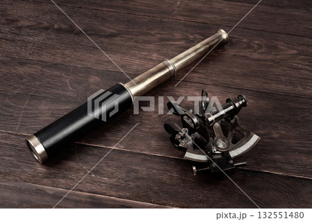 Vintage spyglass telescope with sextant Vintage spyglass telescope with sextant 132551480