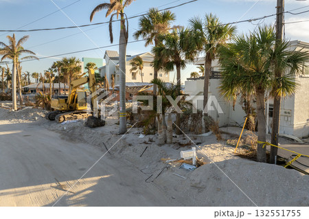 Piles of garbage from severely damaged homes after hurricane Milton storm surge in Florida. Debris on street side on Manasota Key in Englewood. Hurricane aftermath cleanup 132551755