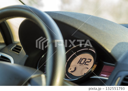Modern car interior with driver hand on steering wheel. Safe driving concept. 132551793