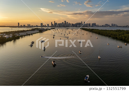 Miami, Florida. Biscayne Bay harbor with many yachts and motor boats. Enjoying sunset over city skyline with high-rise buildings in downtown Miami, Florida. Biscayne Bay harbor with many yachts and motor boats. Enjoying sunset over city skyline with high-rise buildings in downtown 132551799