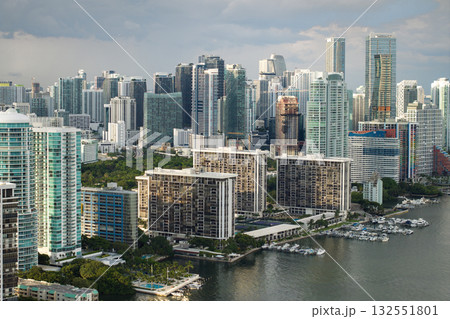 Miami Brickell in Florida, USA. View from above of waterfront skyscraper buildings in downtown district. American megapolis with business financial district Miami Brickell in Florida, USA. View from above of waterfront skyscraper buildings in downtown district. American megapolis with business financial district 132551801