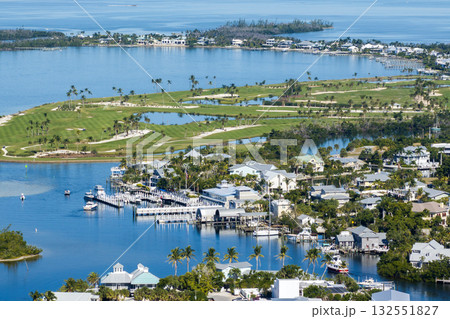 Large residential homes in island small town Boca Grande on Gasparilla Island in southwest Florida. American waterfront houses in rural US suburbs Large residential homes in island small town Boca Grande on Gasparilla Island in southwest Florida. American waterfront houses in rural US suburbs 132551827