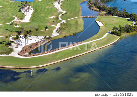 Large golf course and sports grounds with green grass in Boca Grande, small town on Gasparilla Island in southwest Florida 132551829