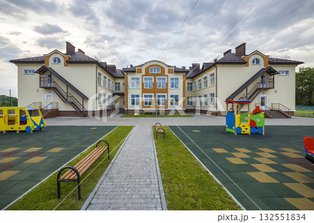 Kindergarten preschool building with big windows. Architecture and development concept. 132551834