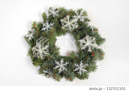 Christmas wreath made of live fir branches and snowflakes, design template, Christmas composition and New Year 2026 concept, Beautiful holiday decoration, winter banner screen, 132552101