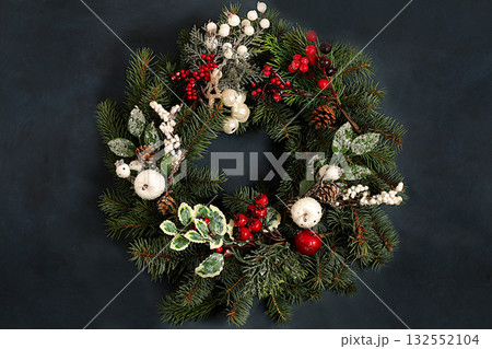 Christmas wreath made of live fir branches, toys and decorations, design template, Christmas composition and New Year 2026 concept, Beautiful holiday decoration, winter banner screen, 132552104