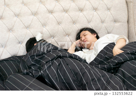Two Thai LGBTQ friends waking up together in a cozy bedroom showing warmth acceptance and genuine friendship representing everyday life diversity love and comfort in the morning light Two Thai LGBTQ friends waking up together in a cozy bedroom showing warmth acceptance and genuine friendship representing everyday life diversity love and comfort in the morning light 132553622