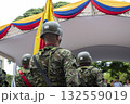 Soldiers with Colombian flag in background, Colombian military in formation, Armed forces with national patriotic symbol 132559019