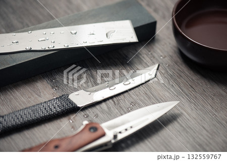Knife sharpening with whetstone 132559767