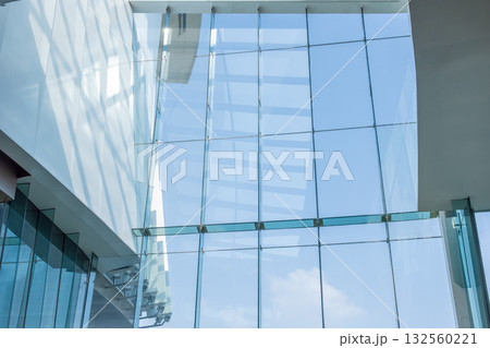 Facade large windows of modern business office building in urban. hall interior mall glass window 132560221