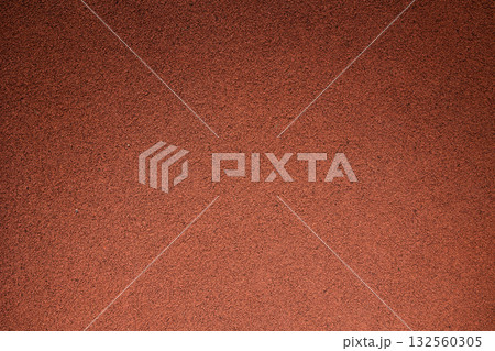 Synthetic running track, red rough rugged rubber floor pattern texture for background Synthetic running track, red rough rugged rubber floor pattern texture for background 132560305