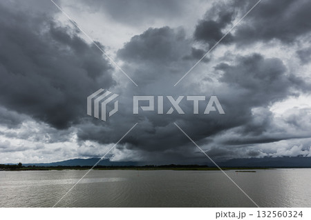 Dark sky storm cloudy river landscape view in raining season Dark sky storm cloudy river landscape view in raining season 132560324