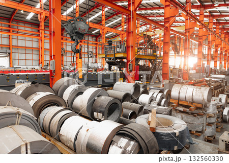 Metal sheet roll, steel sheet roll stock pile storage warehouse heavy industry manufacturing plant. 132560330