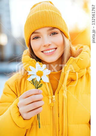 Stylish woman in fluffy blue faux fur coat and sunglasses enjoys coffee at outdoor cafe with a moody ambiance 132561767