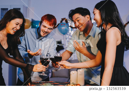 Diversity, dinner and group of people toast celebration together at party. Friends, happy and celebrate with food, wine and friendship for love, support and cheers champagne at business function 132563539