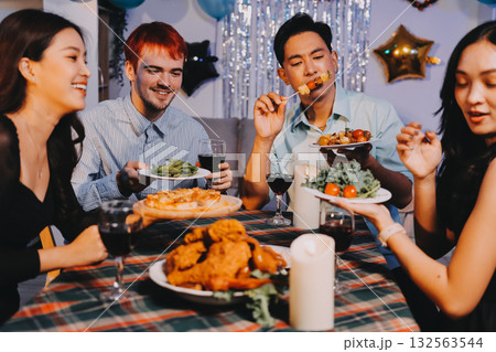 Diversity, dinner and group of people toast celebration together at party. Friends, happy and celebrate with food, wine and friendship for love, support and cheers champagne at business function Diversity, dinner and group of people toast celebration together at party. Friends, happy and celebrate with food, wine and friendship for love, support and cheers champagne at business function 132563544
