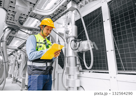 Professional engineer man working, Technician worker schedule check service pipe and valve system 132564290