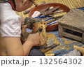 Woodcarving craftsmanship worker closeup working, delicate, detail, meticulous, beautiful wood work 132564302
