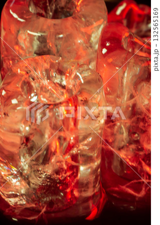 Red-Hued Ice Cubes in Dramatic Lighting Red-Hued Ice Cubes in Dramatic Lighting 132565169