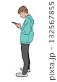 Outline vector illustration of one man standing and looking intently at his smartphone. Concept of mobile technology and digital focus 132567855