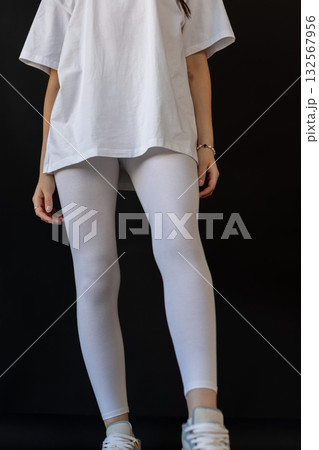 Model wearing white leggings highlighting shape, Mockup presenting waist and overall contour clearly Model wearing white leggings highlighting shape, Mockup presenting waist and overall contour clearly 132567956
